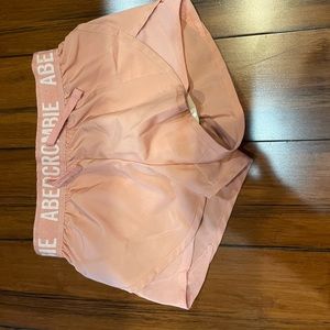 Pink shorts with white letters